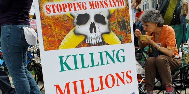 Monsanto has long been accused of causing health hazards. Here was a 2013 eat-in protest in front of the U.S. Food and Drug Administration's Center for Food Safety and Applied Nutrition in College Park, Maryland April 8, 2013.