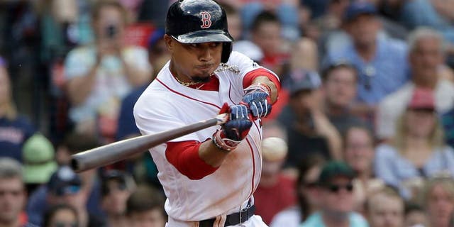 Boston Red Sox's Mookie Betts swings at a pitch in the seventh inning of a baseball game against the Tampa Bay Rays, Sunday, April 16, 2017, in Boston. (AP Photo/Steven Senne)