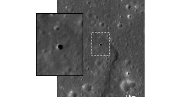 This apparent hole in the moon is like a skylight, a vertical cave 213 feet across and some 262 to 289 feet deep. It is thought to be a collapsed lava tube. The inset shows close-up of the boxed area.