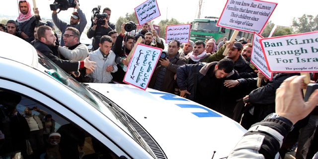 Feb. 2: Palestinian protesters surround a vehicle in the convoy of U.N. Secretary-General Ban Ki-moon as it arrives at Erez border crossing between Israel and Gaza.