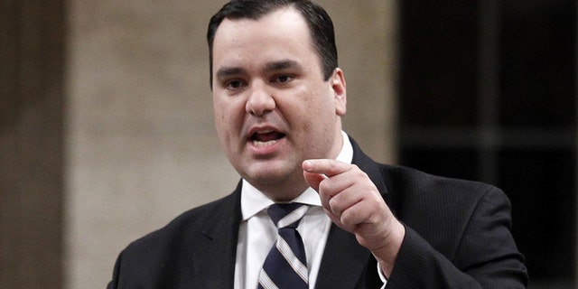 James Moore, the heritage minister in Canada, told Library and Archives of Canada to show “Iranium,” despite threats of violence leveled at the institution