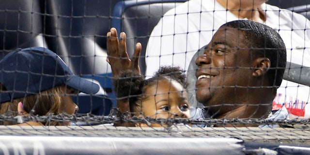 Aug. 4: Tracy Morgan, lower right, sits in the first row behind home plate at the New York Yankees' baseball game against the Boston Red Sox at Yankee Stadium.