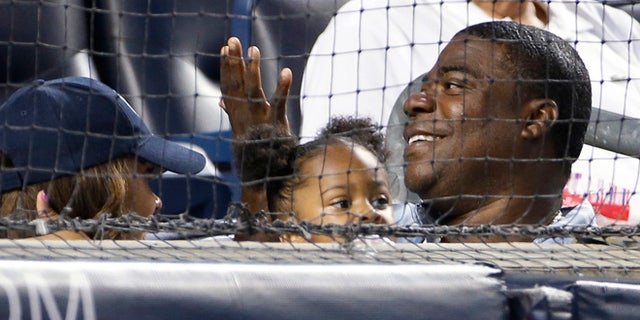 Aug. 4: Tracy Morgan, lower right, sits in the first row behind home plate at the New York Yankees' baseball game against the Boston Red Sox at Yankee Stadium.