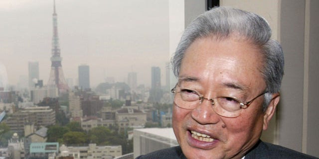 In this April 21, 2003 file photo, Mori Building Co. President Minoru Mori, the developer of the $2.3 billion Roppongi Hills, gestures during the presentation to the media of the sprawling new development with luxury housing and designer shops in the heart of Tokyo.