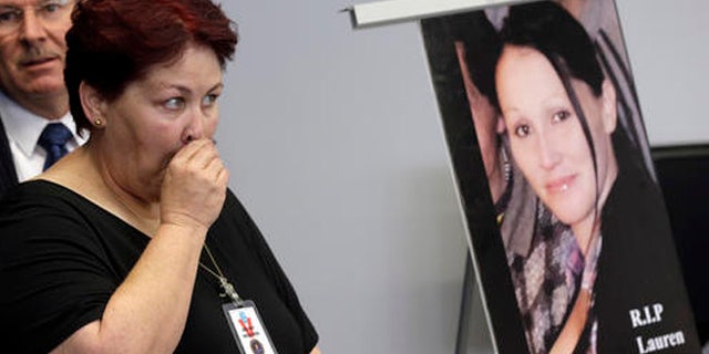 Jerilyn Olguin, mother of murder victim Lauren Elaine Olguin, seen in the photo, appears at a FBI news conference announcing additions to its 10 Most Wanted list, in Los Angeles Thursday, May 19, 2016. Fugitive Philip Patrick Policarpio is suspected in the shooting death of his pregnant girlfriend, Lauren Olguin, on April 12, 2016 in Los Angeles, has been added to the FBI's 10 Most Wanted list.(AP Photo/Nick Ut)