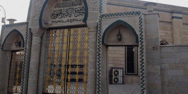In this 2014 file photo, the gate of the Great Mosque or al-Nuri Mosque is seen in the northern city of Mosul, Iraq. The Islamic State group destroyed Mosul’s al-Nuri mosque and its iconic leaning minaret late Wednesday night when fighters detonated explosives inside the structures, according to Iraq’s Ministry of Defense.