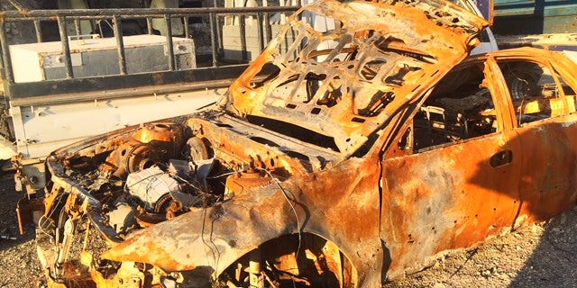 The remains of a car destroyed by fire