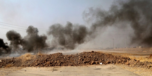 Smoke rises from Islamic state positions after an airstrike by coalition forces in villages surrounding Mosul.