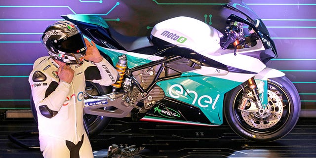 Former MotoGP rider Loris Caprirossi unveils MotoE's Energica Ego racing bike.