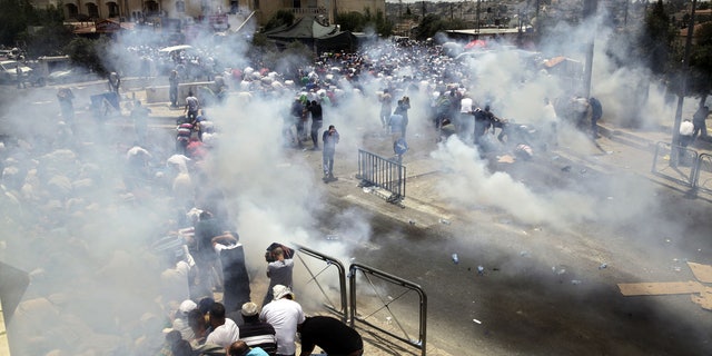 An escalating dispute over metal detectors at a contested Jerusalem shrine turned violent on Friday, setting off widespread clashes between Palestinian stone-throwers and Israeli troops.