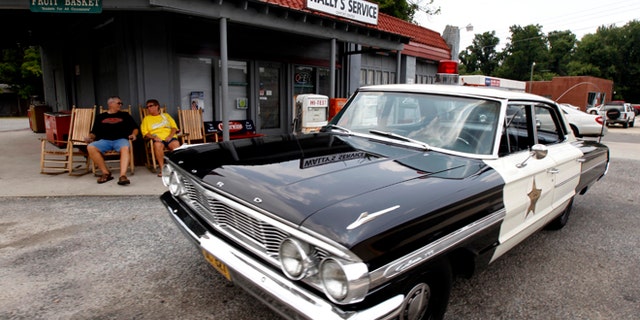 July 3, 2012: Mike and Terry Jones sit outside Wally's Service, a replica of the Andy Griffith Show, in Mount Airy, N.C.