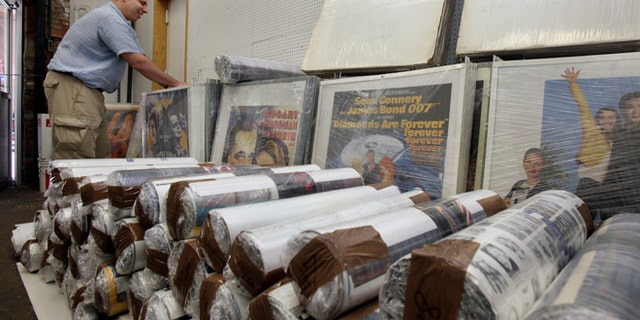 July 25, 2012: In this photo, Ira Kramer, nephew of the original Movie Star News founder Irving Klaw, looks over movie posters packed for transport, at the shop in New York.