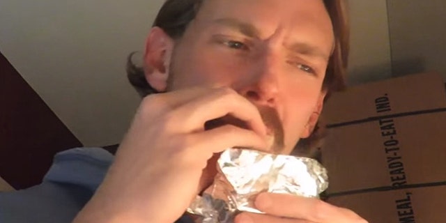 A ration reviewer who goes by Steve1989 samples chocolate from an MRE issued during World War II.