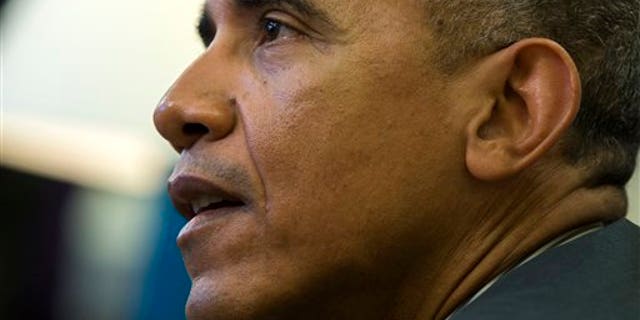 President Barack Obama meets with a group of immigration advocates in the Oval Office of the White House in Washington, Wednesday, Feb. 4, 2015. (AP Photo/Evan Vucci)