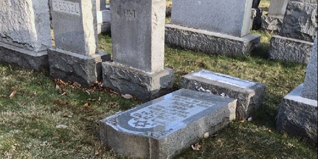 Feb. 26, 2017: The tombstone of a Jewish person lies on the ground at Mount Carmel Cemetery in Frankford, Pa.