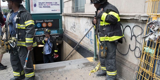 New York City emergency personnel work at the scene of the subway derailment on Tuesday, June 27, 2017.