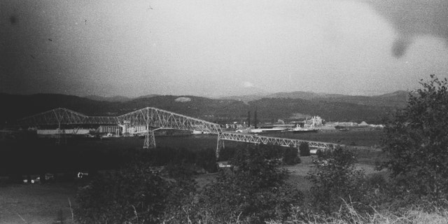 The Mount St. Helens eruption with the Longview Bridge in the foreground