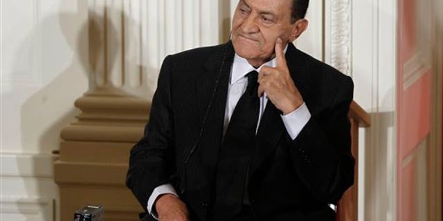 In this Sept. 2010 file photo, Egypt's President Hosni Mubarak listens as Israel's Prime Minister Benjamin Nethanyahu, unseen, speaks in the East Room of the White House in Washington.