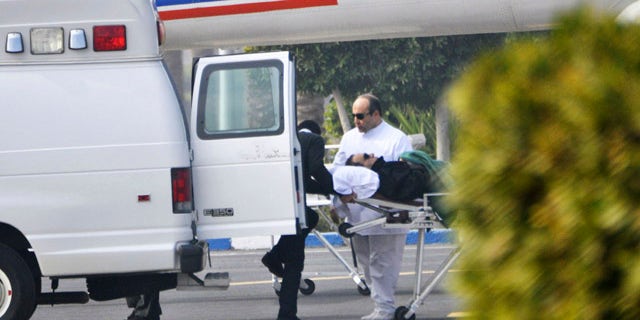 Jan. 4, 2012: Former Egyptian president Hosni Mubarak is wheeled into a van after attending a trial in Cairo, Egypt.