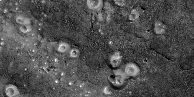 The mud volcanoes shown here, located in the Southern Acidalia Planitia region of Mars, might contain organic materials that could hold signatures of life.