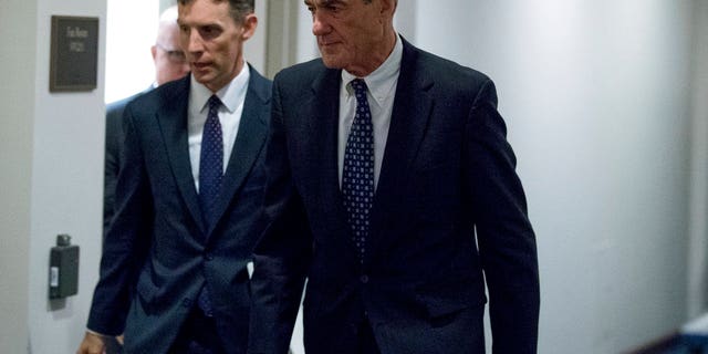 FILE - In this June 21, 2017, file photo, special counsel Robert Mueller departs Capitol Hill following a closed door meeting. Mueller's office issued its first public statement in well over a year on Friday, to discredit a BuzzFeed report on its Russia probe.