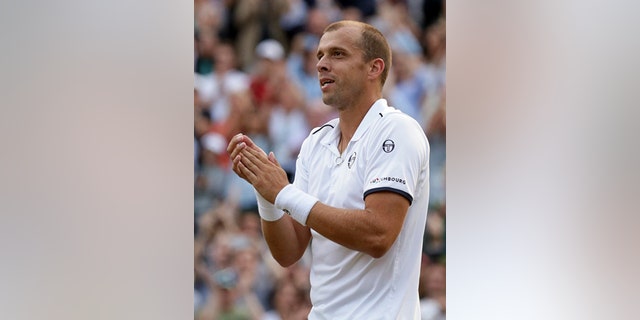 Gilles Muller celebrates after beating Rafael Nadal in the Round of 16 at Wimbledon Monday.
