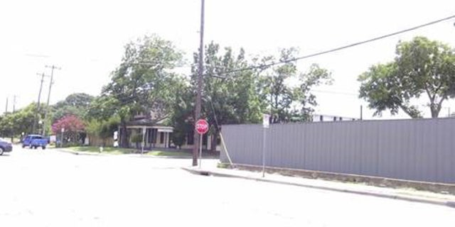 A photo of the fence outside the Last Call Lounge without the mural in June 2017.