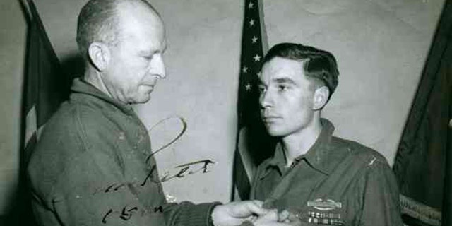 Lt. General Alexander M. Patch awards Garlin Murl Conner the Distinguished Service Cross, Feb. 10, 1945 for extraordinary heroism in action.