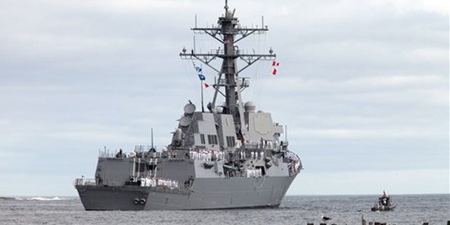 The Michael Murphy, the last of the U.S. Navy's original run of Arleigh Burke destroyers, heads down the Kennebec River off of Phippsburg, Maine, Wednesday, Sept. 5, 2012.