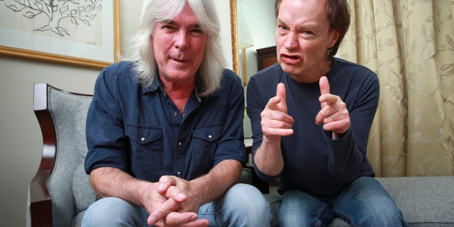 In this Nov. 13, 2014 file photo, members of the rock band AC/DC, bassist Cliff Williams, left, and guitarist Angus Young pose for a portrait in promotion of their upcoming album, "Rock or Bust" in New York.
