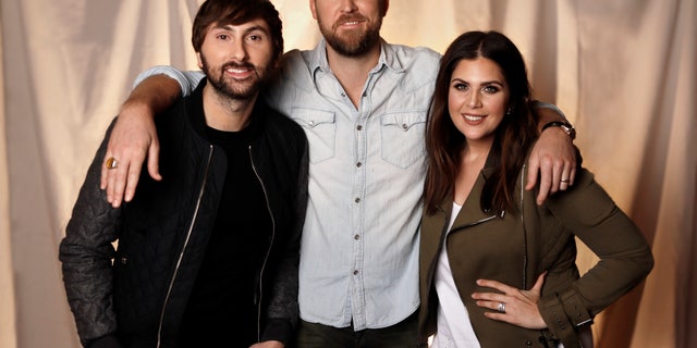 In this Jan. 9, 2017, photo, the members of Lady Antebellum, from left, Dave Haywood, Charles Kelley and Hillary Scott pose in Nashville, Tenn.