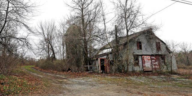 An old barn stands on land in Dudley, Mass., at the site of the proposed Muslim cemetery.