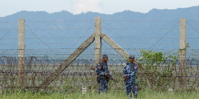 Burmese border guard police patrol near the Burma-Bangladeshi border outside Maungdaw, northern Rakhine state, November 12, 2017