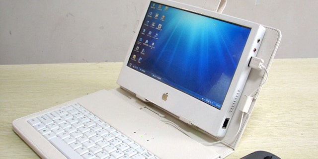 Liu Xinying's "DIY IPAD 3" touchscreen tablet computer, shown with a case, keyboard and mouse.