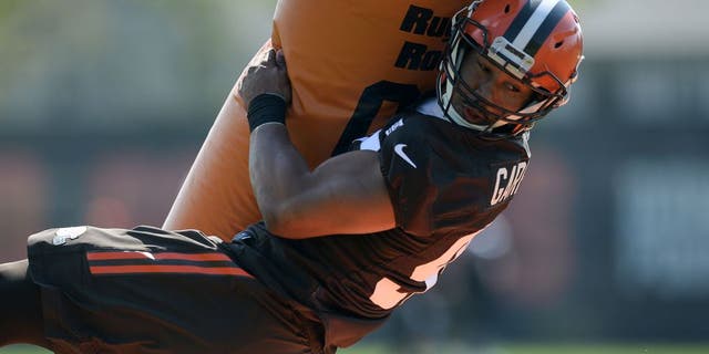 BEREA, OH - MAY 13, 2017: Defensive end Myles Garrett #95 of the Cleveland Browns takes part in a tackling drill during a rookie mini camp practice on May 13, 2017 at the Cleveland Browns training facility in Berea, Ohio. 17-05136945 2017 Nick Cammett/Diamond Images/Getty Images