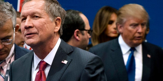 Feb. 6, 2016: Ohio Gov. John Kasich, left, and Donald Trump, right, speak to reporters after a Republican presidential primary debate hosted by ABC News at Saint Anselm College in Manchester, N.H.