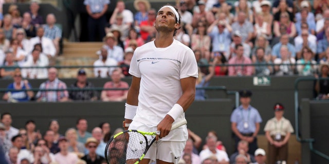 Rafael Nadal looks up during his Round of 16 match against Gilles Muller at Wimbledon Monday