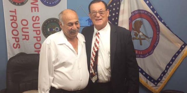 Nakoula, seen here with the Rev. Wiley S. Drake, lives in a homeless shelter.