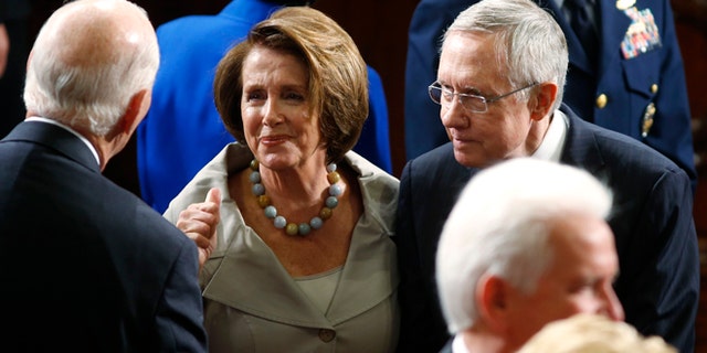 In this Sept. 18, 2014 photo, House Minority Leader Nancy Pelosi, D-Calif., and U.S. Senate Majority Leader Harry Reid, D-Nev., shown entering the House chamber on Capitol Hill in Washington.