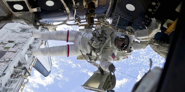 Astronaut Rick Mastracchio is shown participating in a spacewalk in this image provided by NASA and taken April 13.