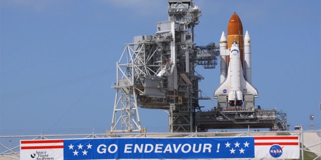 NASA must now deal with scammers on top of a delayed shuttle launch.