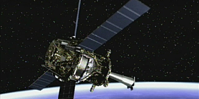 Artist's concept of Gravity Probe B spacecraft in orbit around the Earth.