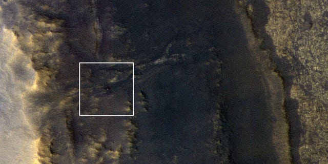 NASA's Opportunity rover appears as a blip in the center of this square. This image taken by HiRISE, a high-resolution camera onboard NASA's Mars Reconnaissance Orbiter, shows the dust storm over Perseverance Valley has substantially cleared.