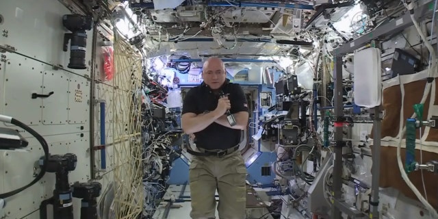 In this image from video made available by NASA, astronaut Scott Kelly speaks to reporters on Earth during a news conference held on the International Space Station on Thursday, Feb. 25, 2016. (NASA via AP)