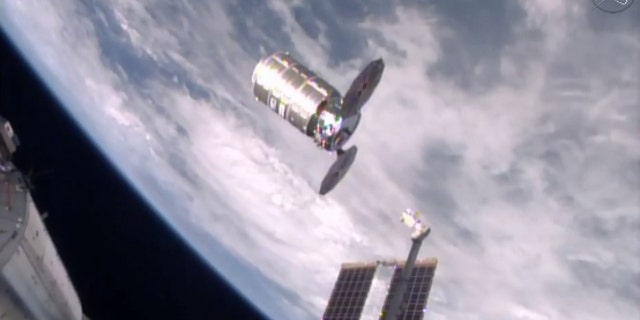 This photo taken from NASA TV shows a capsule loaded with 1.5 tons of trash, released from the International Space Station on Friday, Feb. 19, 2016. NASA supplier Orbital ATK launched the capsule, named Cygnus, to the space station in December, full of food, clothes and other goods. Astronauts removed the precious contents, then filled it with garbage for incineration. The spacecraft should re-enter the atmosphere and burn up harmlessly over the Pacific on Saturday. (NASA via AP)