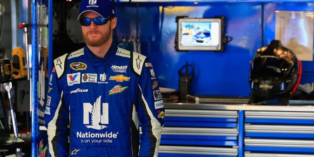 LOUDON, NH - SEPTEMBER 26: Dale Earnhardt Jr., driver of the #88 Nationwide Chevrolet, stands in the garage area during practice for the NASCAR Sprint Cup Series Sylvania 300 at New Hampshire Motor Speedway on September 26, 2015 in Loudon, New Hampshire. (Photo by Chris Trotman/Getty Images)