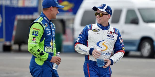 SPARTA, KY - JULY 07: Daniel Hemric, driver of the #19 Oakmont Management Group Ford, talks to Tyler Reddick, driver of the #29 Cooper Standard Ford, during qualifying for the NASCAR Camping World Truck Series Buckle Up In Your Truck 225 at Kentucky Speedway on July 7, 2016 in Sparta, Kentucky. (Photo by Drew Hallowell/NASCAR via Getty Images)