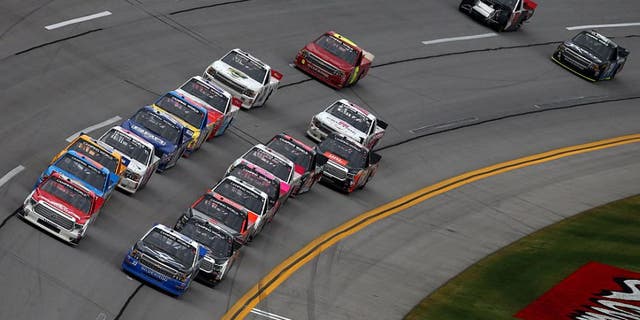 TALLADEGA, AL - OCTOBER 24: Timothy Peters, driver of the #17 Red Horse Racing Toyota, and Brandon Jones, driver of the #33 Wittichen Supply Company Chevrolet, lead the field to a restart during the NASCAR Camping World Truck Series fred's 250 at Talladega Superspeedway on October 24, 2015 in Talladega, Alabama. (Photo by Tom Pennington/Getty Images)