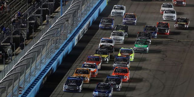 AVONDALE, AZ - NOVEMBER 11: Tyler Reddick, driver of the #29 Cooper Standard Ford, and William Byron, driver of the #9 Liberty University Toyota, lead the field in a restart during the NASCAR Camping World Truck Series Lucas Oil 150 at Phoenix International Raceway on November 11, 2016 in Avondale, Arizona. (Photo by Christian Petersen/Getty Images)