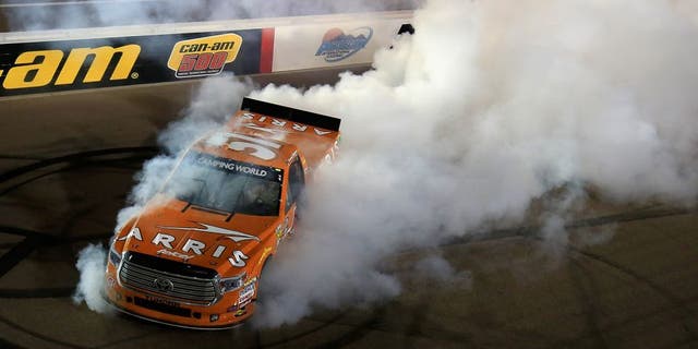 AVONDALE, AZ - NOVEMBER 11: Daniel Suarez, driver of the #51 ARRIS Toyota, celebrates with a burnout after winning the NASCAR Camping World Truck Series Lucas Oil 150 at Phoenix International Raceway on November 11, 2016 in Avondale, Arizona. (Photo by Chris Trotman/NASCAR via Getty Images)